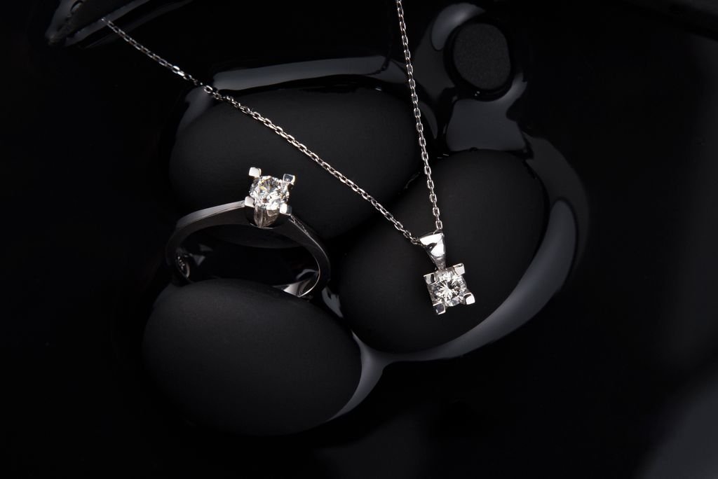 Does Renters Insurance Cover Jewelry? Limits, Theft, and Extra Coverage Jewelry with gemstones on a dark background