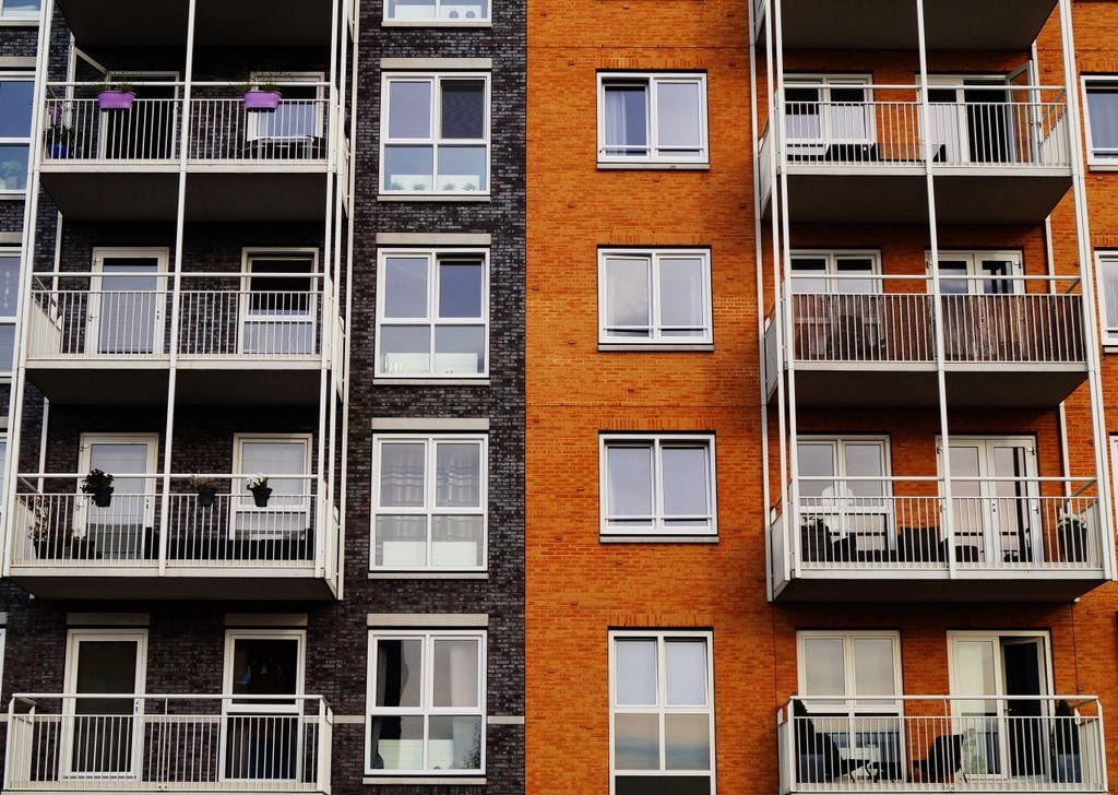 Joint Tenancy vs Community Property: Key Differences Explained Exterior of an apartment building with balconies