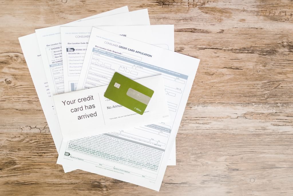 What Is a Stale Dated Check? Can You Still Deposit It? Bank letters spread out on a wooden surface