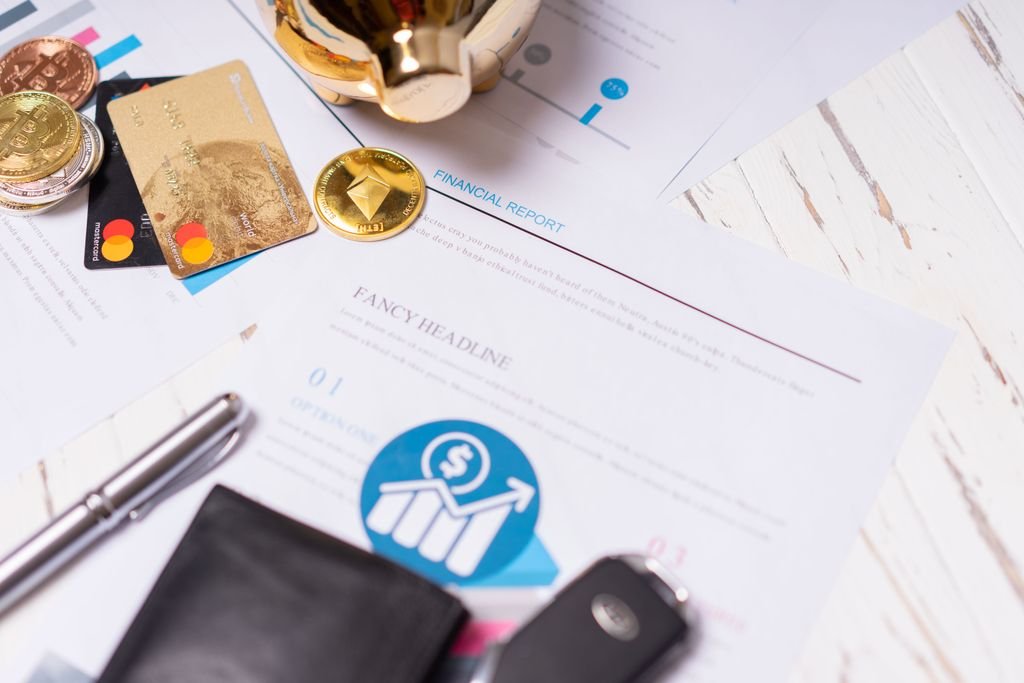 What Is Credit Mix and How Does It Affect Your Credit Score Payment cards, coins and charts spread across a desk