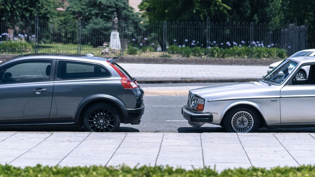 Two cars parked along a street