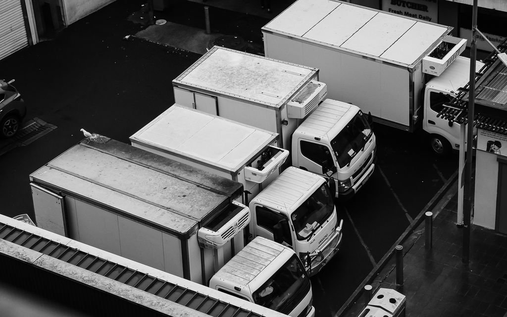 Aerial view of commercial box trucks parked side by side