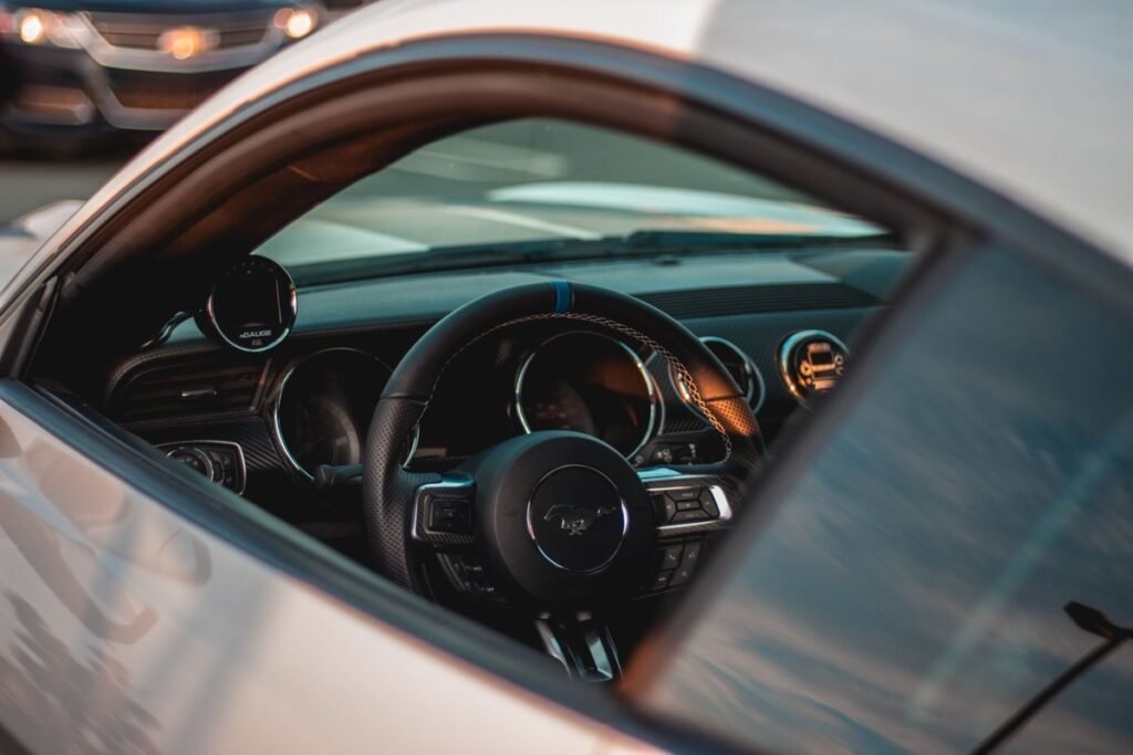 Interior of a car showing the steering wheel and dashboard