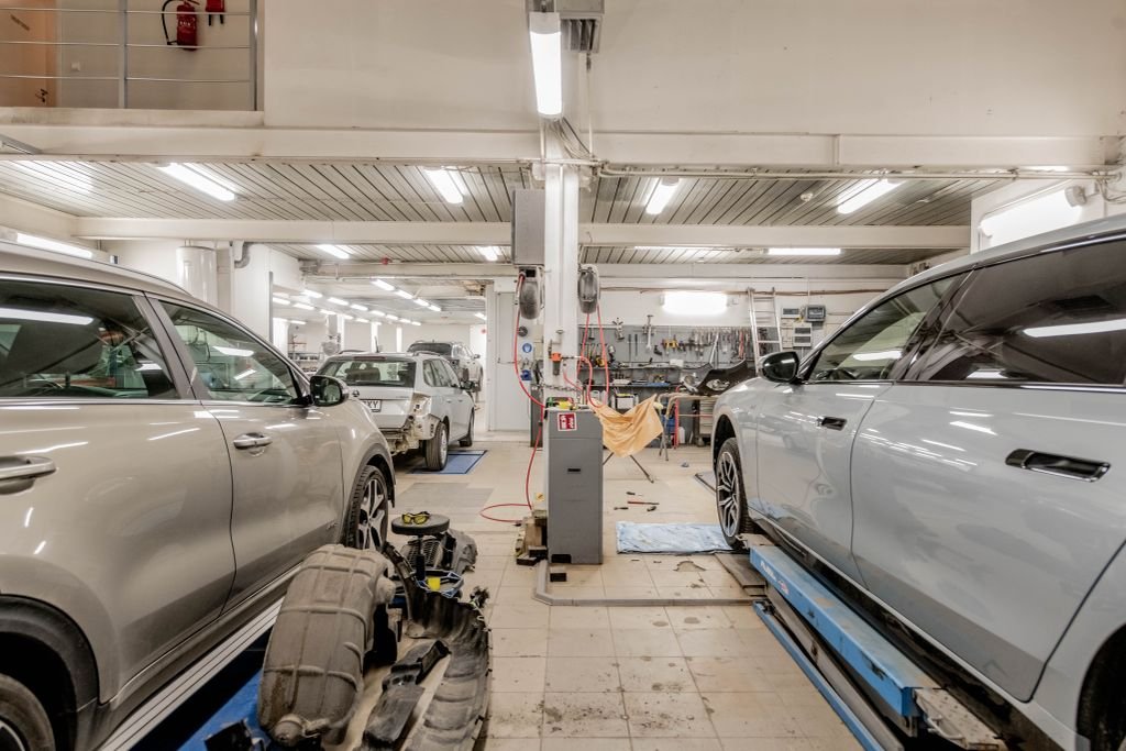 Garage Keepers Insurance: Coverage, Costs and Who Needs It Cars inside an automotive repair workshop