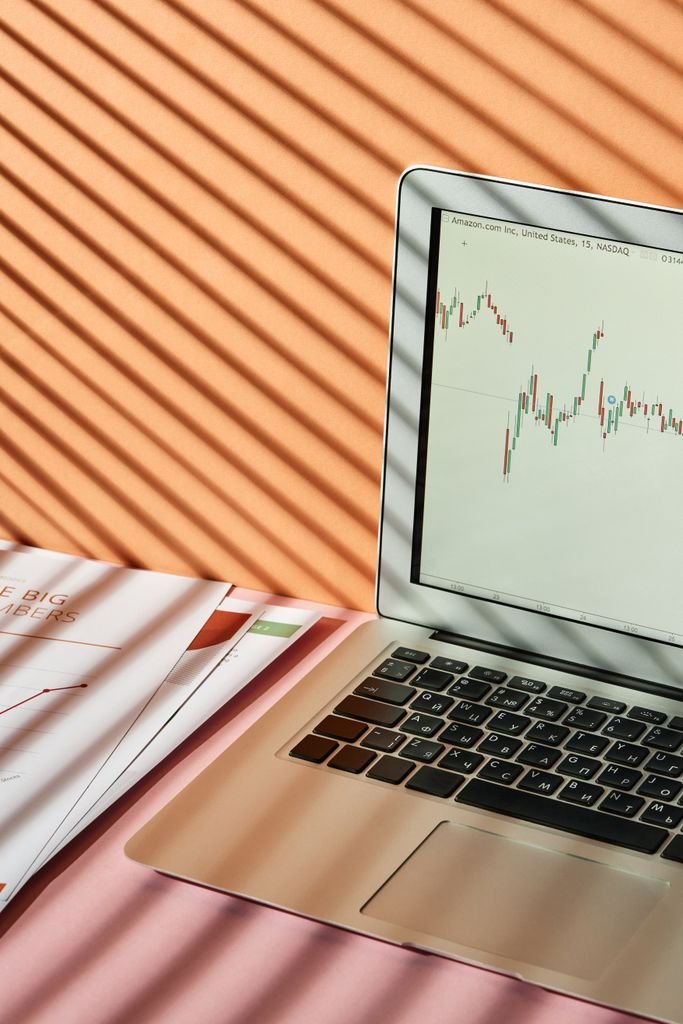 Cash Available to Trade vs Settled Cash: 3 Key Differences Laptop displaying a financial market chart