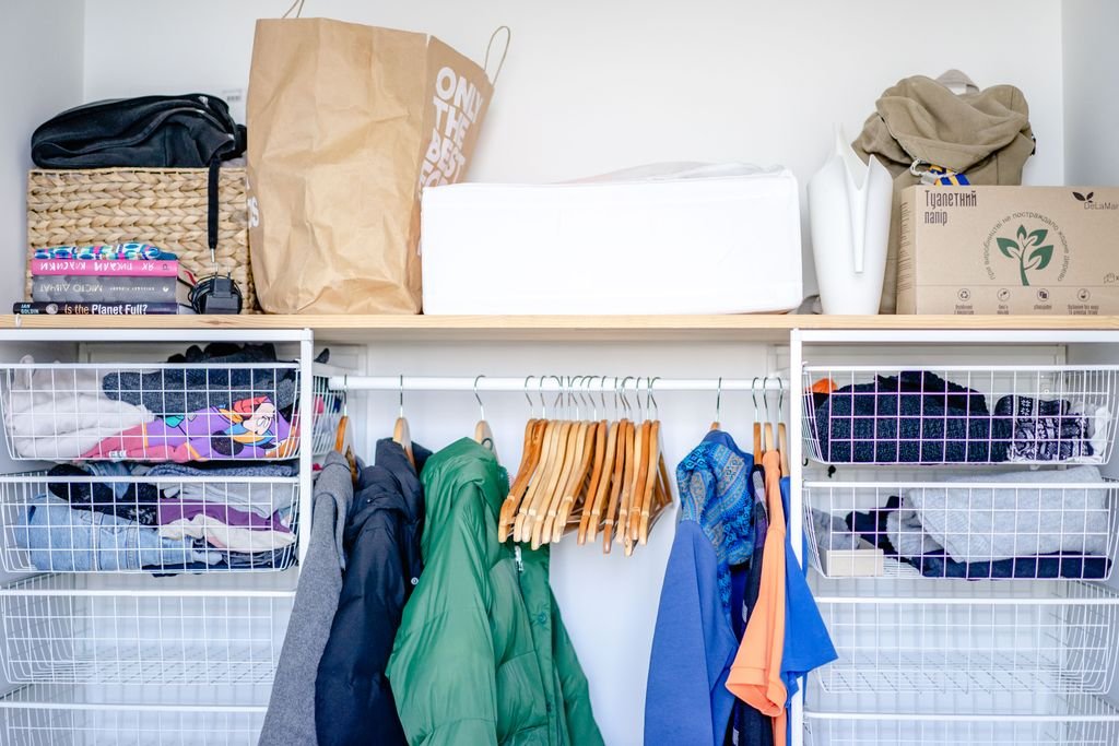 Clothing Categories for Insurance Appraisal: A Home Inventory Checklist Open wardrobe with clothes on hangers, folded garments and storage baskets