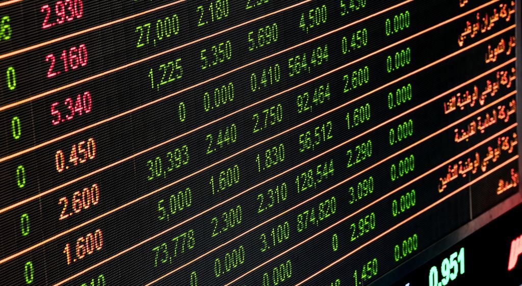 What Is a Stock Warrant? How It Works, Examples and Risks Stock market display showing share prices and changes