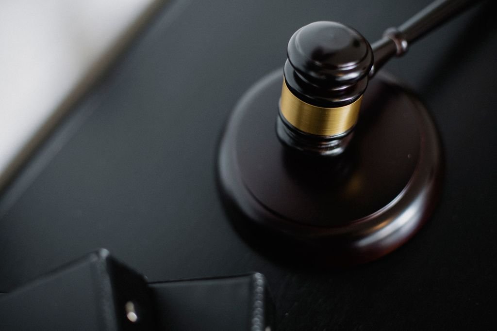 Probate Bond: Requirements, Costs and Waivers Close-up of a wooden gavel and its base
