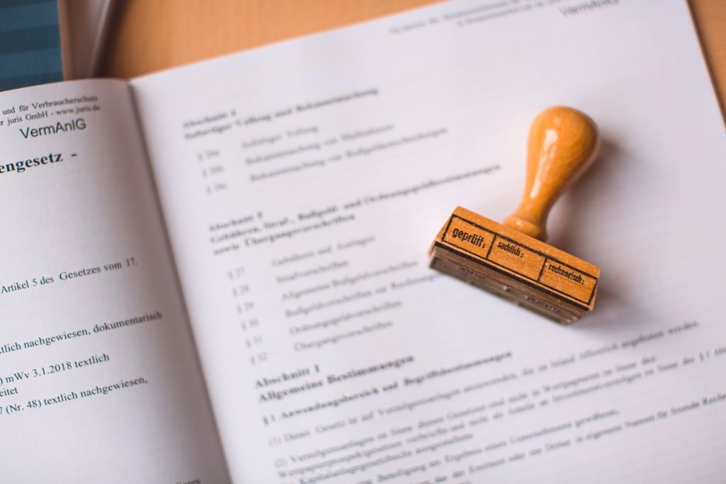 Letters Testamentary: What They Are and How to Obtain Them Wooden stamp resting on an open document
